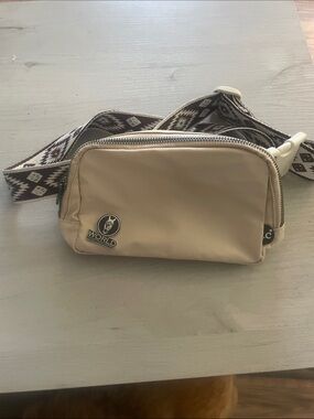 Beige Crossbody Belt Bag with Patterned Strap from World Equestrian Center store